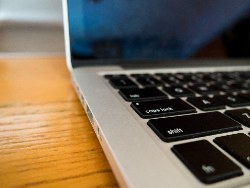 A laptop on a kitchen table