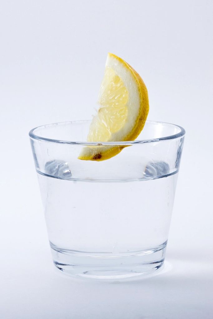 A glass of water with lemon